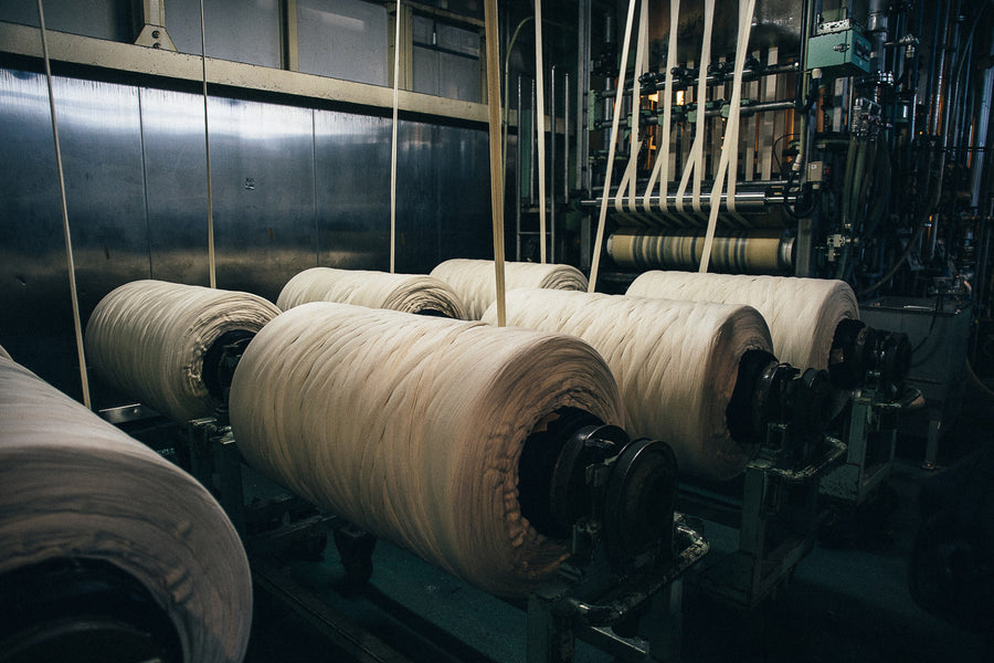 Large rolls of undyed cotton