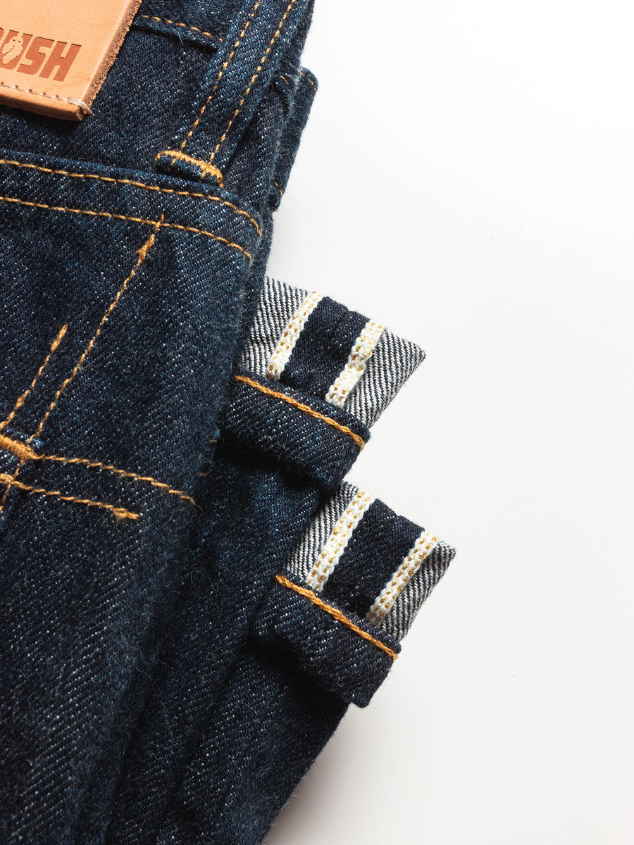 An up close image of the gold selvedge detail on the jeans.