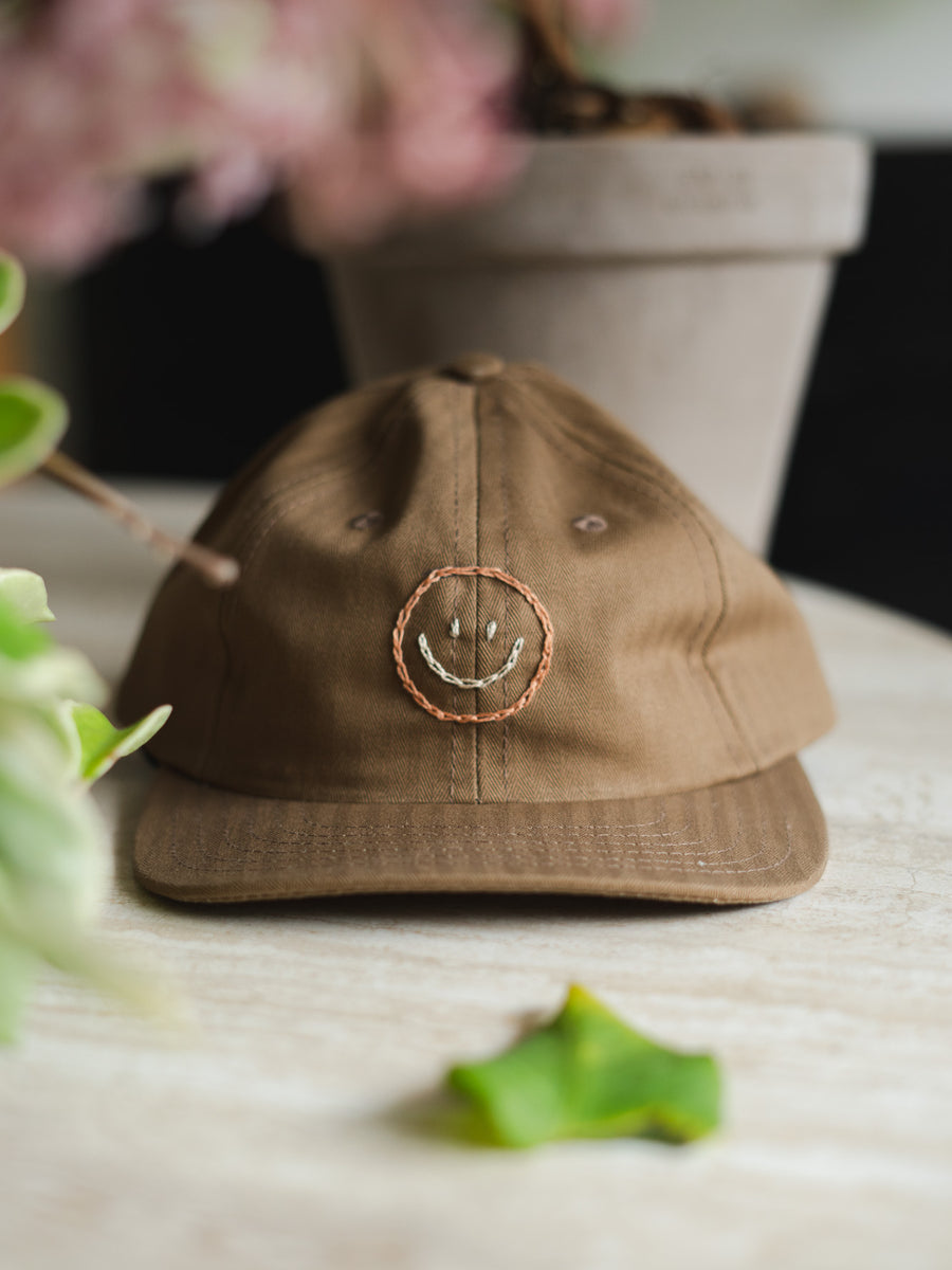 Smiley Caps by Jaime Wong.