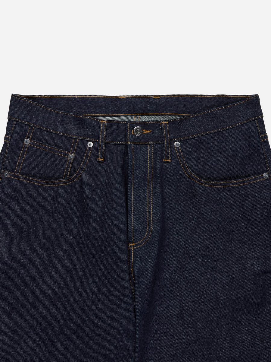 Dark blue denim jeans with a plain background