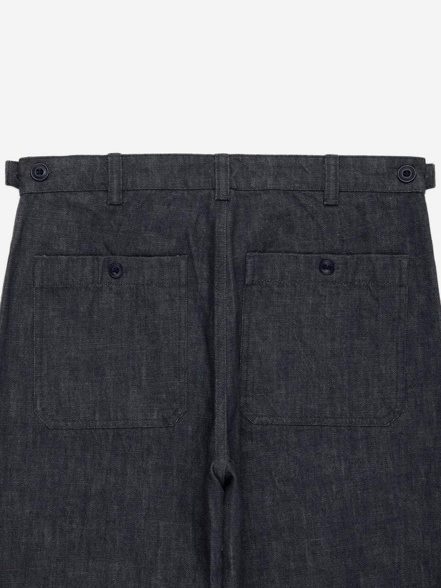 Close-up of the back waistband and rear pockets of dark charcoal gray trousers, showing belt loops, button details, and a drawstring waist on a light gray background.