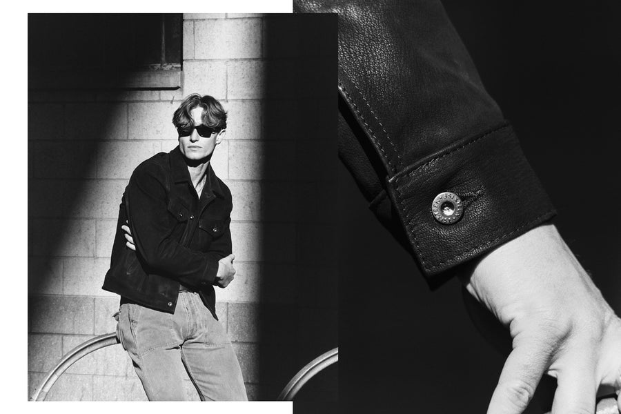 A man in a leather jacket basks in the sunlight.