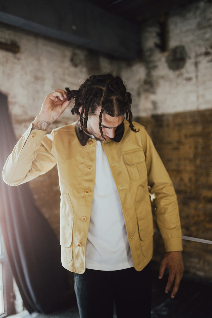 Man wearing tan hunting jacket.