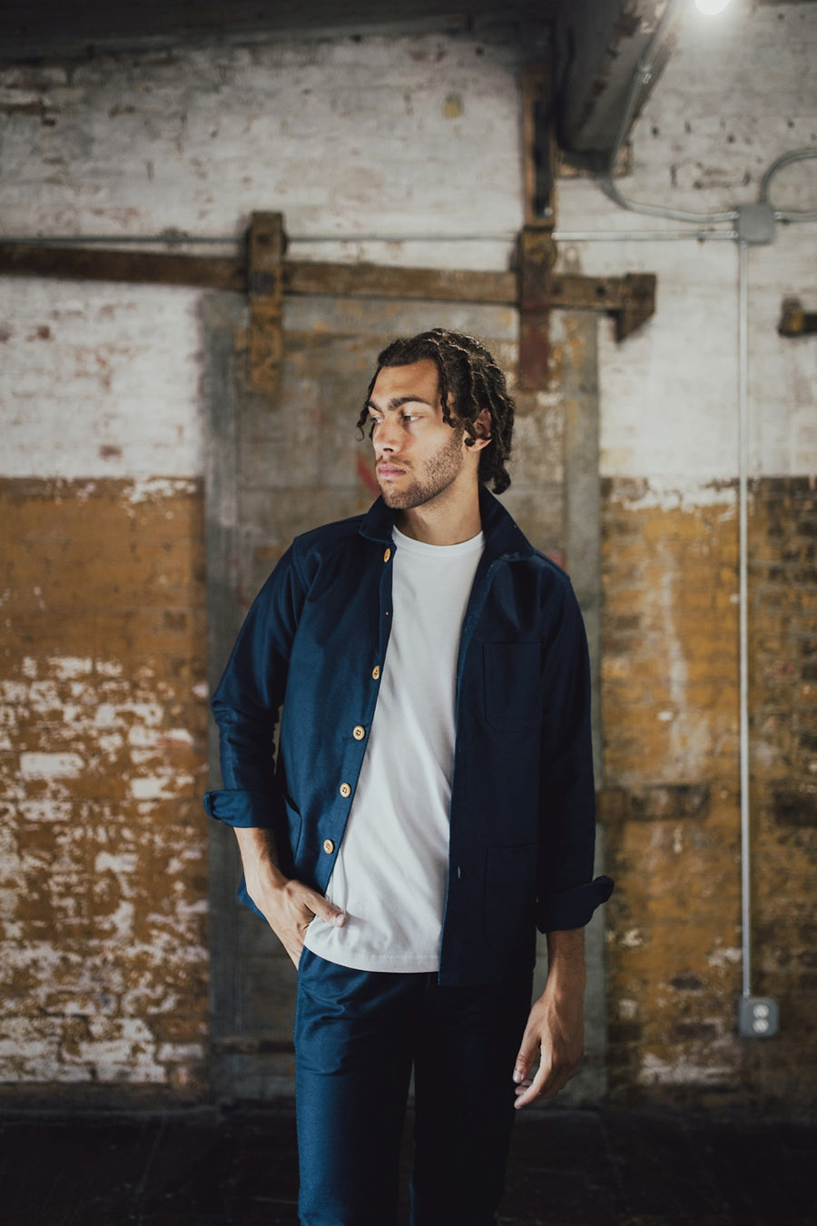 Man wearing navy shop jacket.