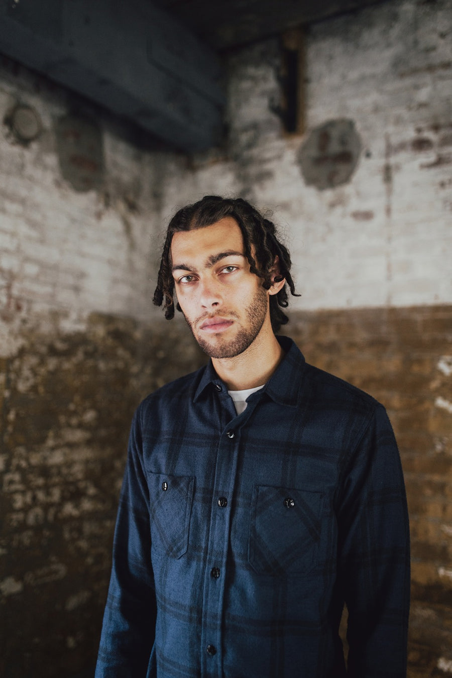Man wearing navy flannel shirt.