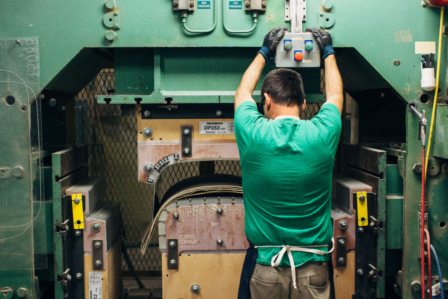 A machine that presses plywood into forms.