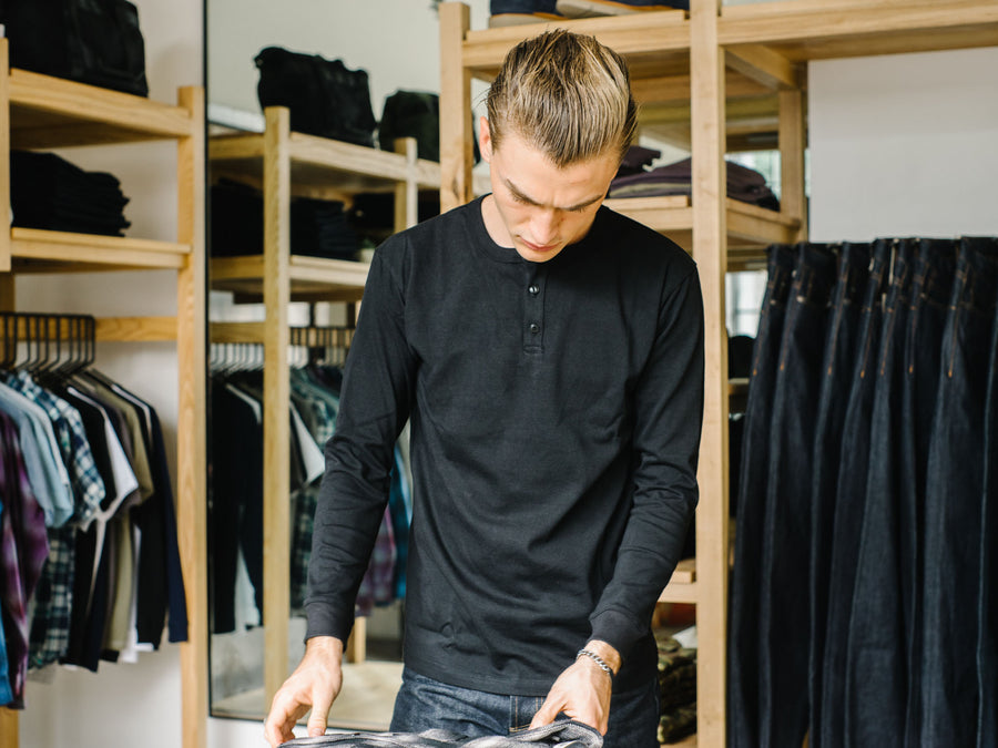 Man wearing black long sleeve shirt.