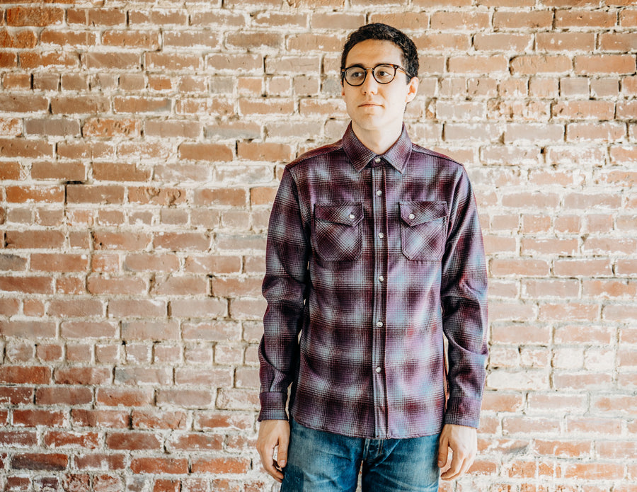 Spencer is wearing the purple ombre over shirt.