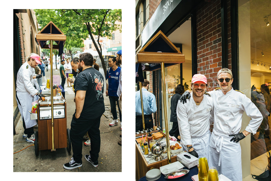 The men serving hot dogs from the cart.