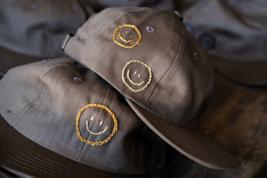 Smiley Caps by Jaime Wong.