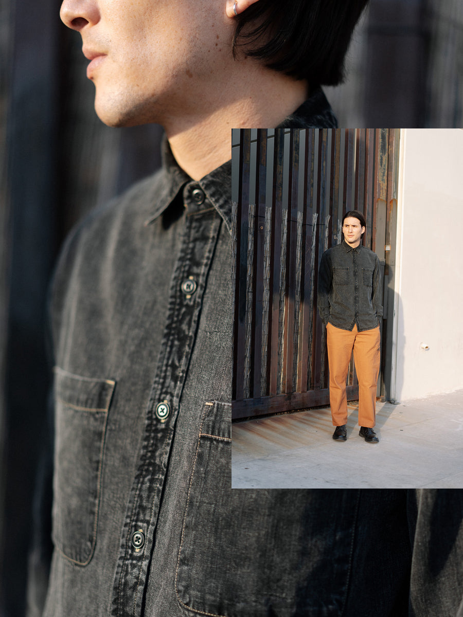 A detailed photo of a black stonewashed shirt 