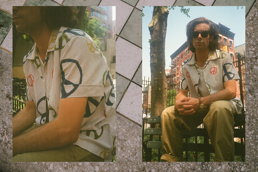 Detail images of a man wearing a colorful peace shirt while sitting on a park bench.