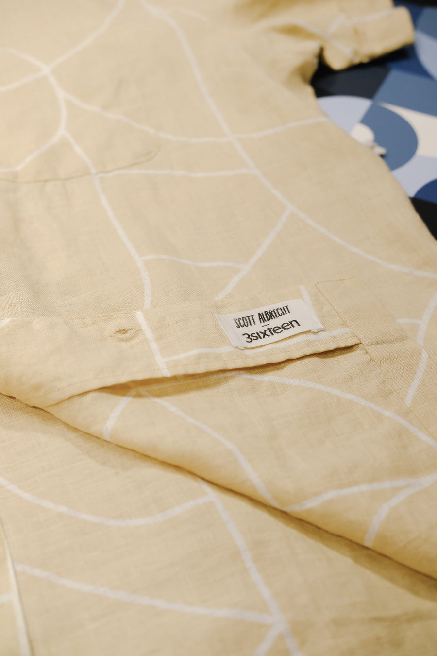 A label sewn into a shirt says Scott Albrecht 3sixteen on it.