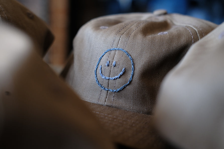 Smiley Caps by Jaime Wong.